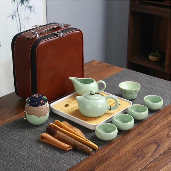 

Дорожный чайный набор Ruyao Kung Fu, маленький набор, одна кастрюля, четыре или шесть чашек, простой портативный керамический чайный набор, подаро...