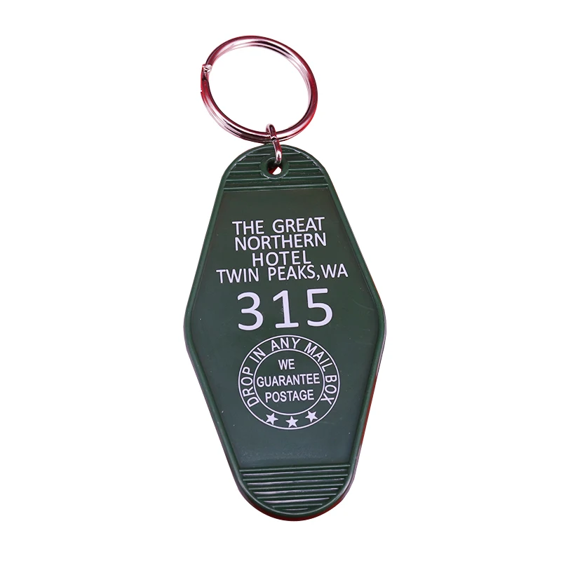 Green with white printed "Twin Peaks" inspired Great Northern Hotel keychain