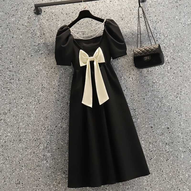 

Женское винтажное платье с открытой спиной и бантом