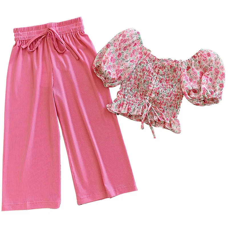 

Костюм для девочек, новинка 2021, комбинация на одно плечо с цветочным принтом + брюки с широкими штанинами, детская одежда из двух предметов