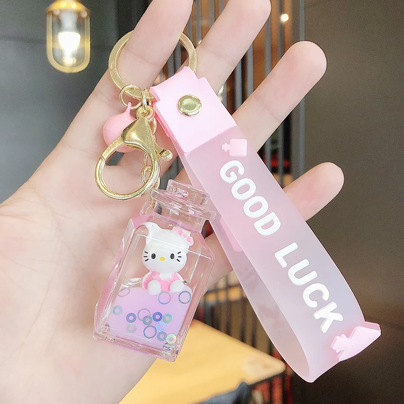 

Cartoon kitten exquisite key chain creative girl bag key chain perfume bottle car pendant quicksand floating bottle