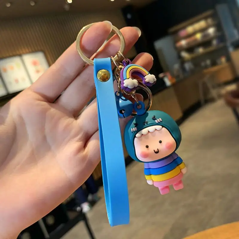 

Fashion Couple Friend Gift Cartoon Little Dinosaur Coat Rainbow Bell Little Person Silicone Cute Bag Phone Car Key Chain K20028