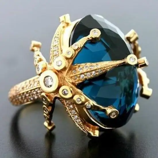 Фото Женское кольцо с синим павлином и морской звездой из желтого золота уникальным