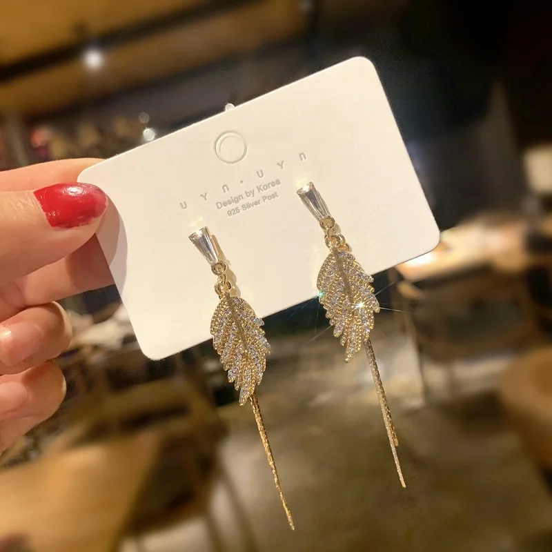 

Banana leaf tassel new year earrings temperament long face thin net red personality simple earrings women