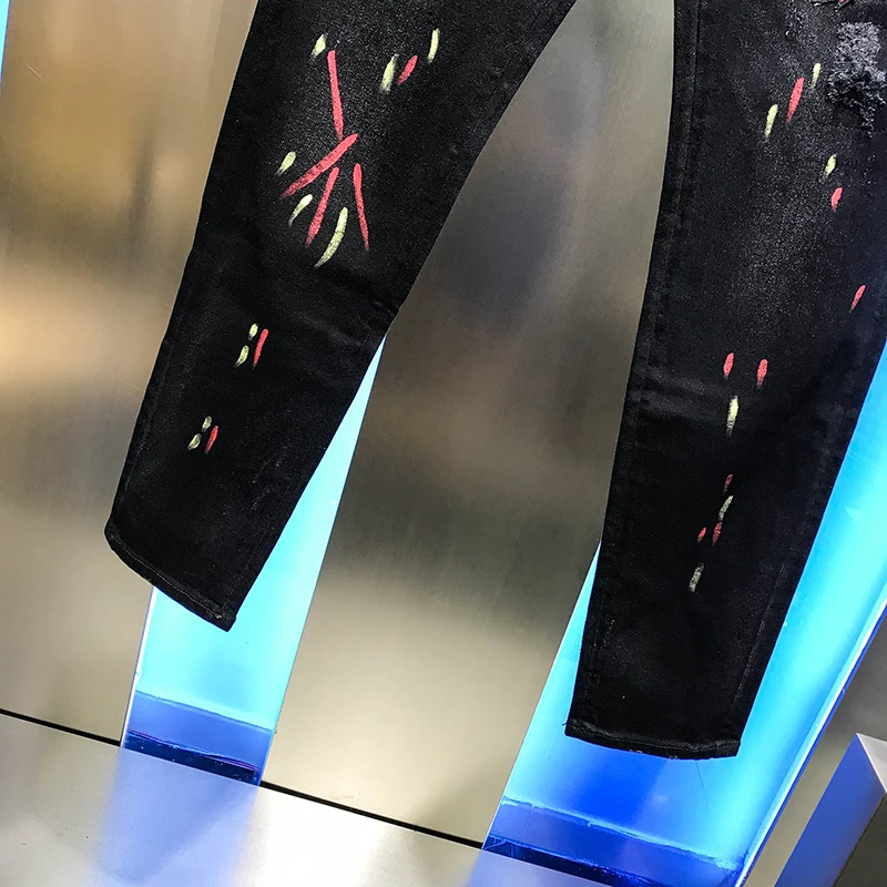 

European station autumn 2020 new men's versatile personalized trousers letter painted printing Black Slim jeans trend youth