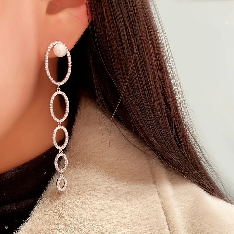 

Asymmetric interlocking circle pearl earrings female long tassel earrings irregular circle pearl earrings