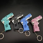 Брелок для ключей Aqumotic с мягким пневматическим пистолетом, декоративная цепочка для ключей, портативный полностью металлический складной, мягкая пуля, 8 см, 1 шт.