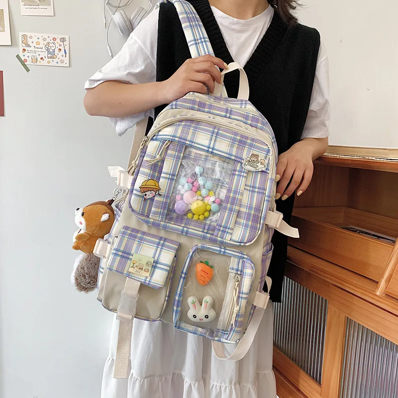 

New school bag in 2021 female simple versatile college students design sense of large capacity grid backpack summer