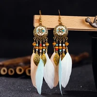 thailand womens bohemian style pendant long gold color alloy round pendant feather flowing long earrings 2020 gypsy jewelry