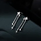 Серьги-подвески серебряного цвета в форме звезды с кисточками