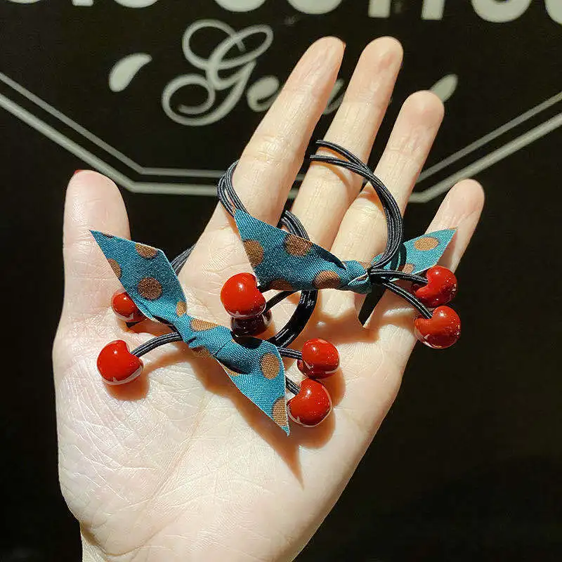 

100pcs / lot black high-elastic hair rope small cherry head rope girl tied hair rubber band hair ring hair ornaments
