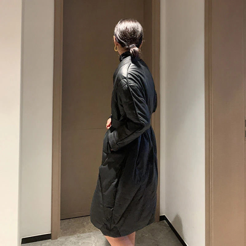 Пуховик из овечьей кожи Haining черная куртка средней длины искусственной с поясом