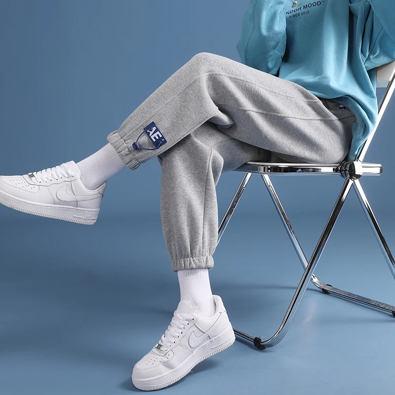 

Plush and thickened grey sports pants women's loose hemmed in autumn and winter