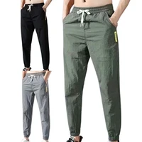 50 hot sales men pants solid color drawstring summer ankle tied pockets trousers for sports