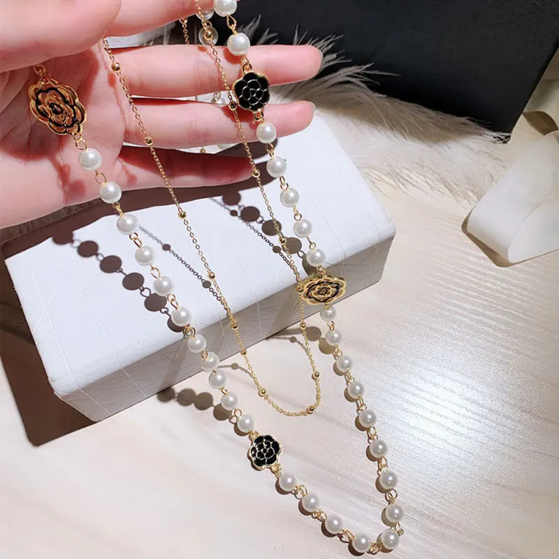 

Luxury Hollow Camellia Pearl Pendant Necklaces Flower Winter Sweater Chain Necklace Jewelry for Women