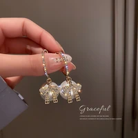 925 silver needle korean fashion personality net red temperament design sense diamond inlaid freshwater pearl bow earrings
