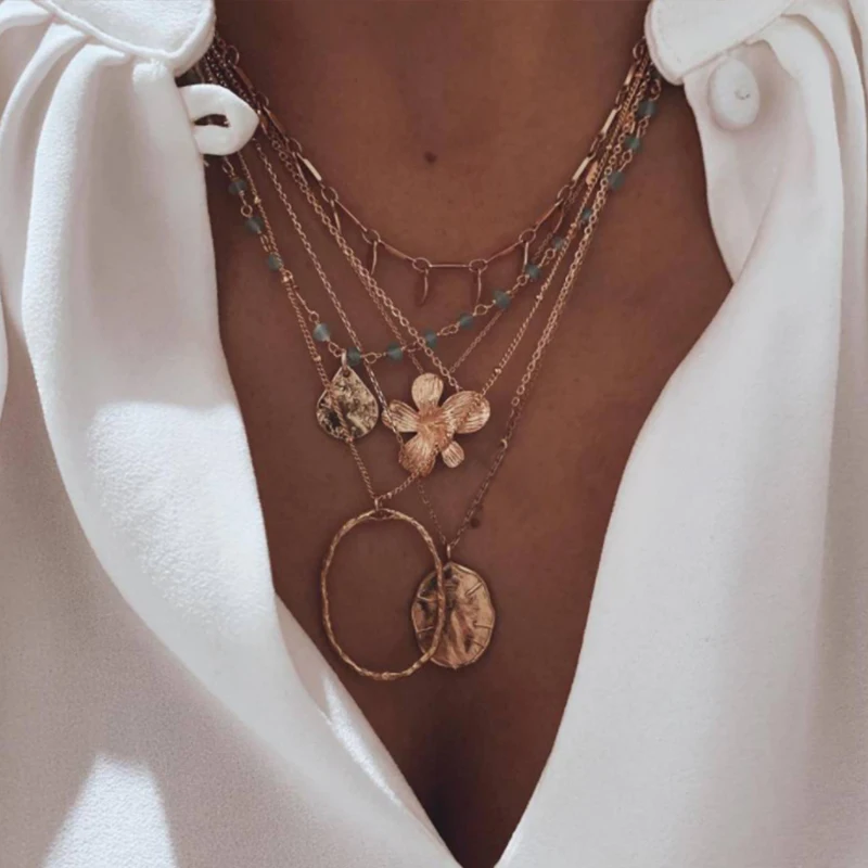 Женское колье с подвеской в виде цветка золотистого цвета | Украшения и