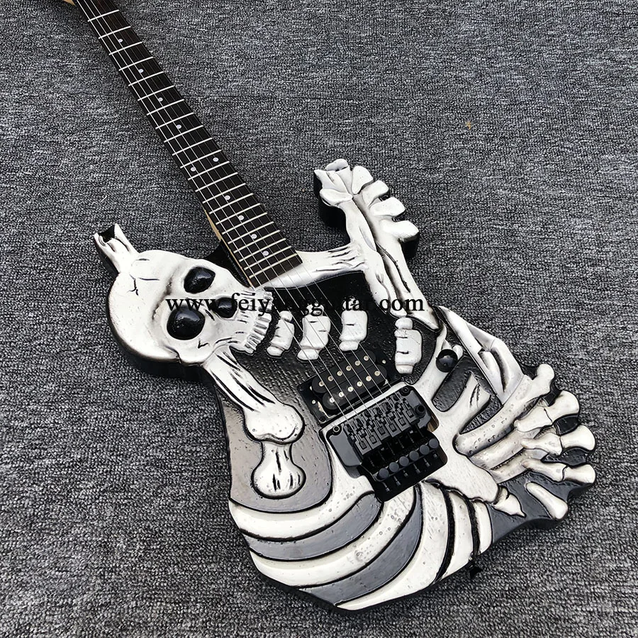 

High quality 6 string electric guitar, alien guitar, skull electric guitar, white painted paint, maple neck, black accessories,