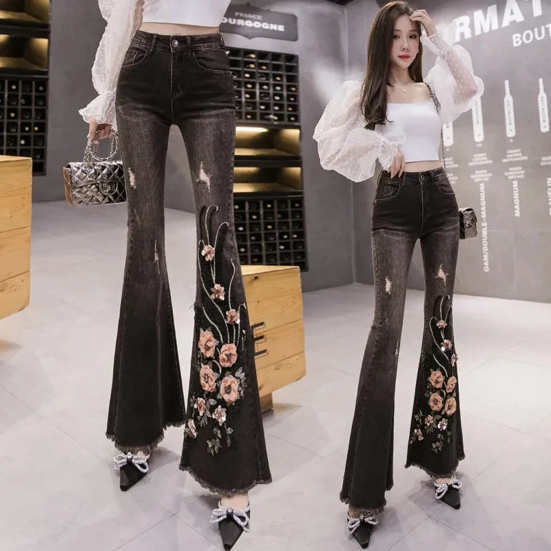 

Женские брюки, новые модные черные джинсовые расклешенные брюки, женские эластичные облегающие тяжелые драпированные брюки с цветочной вы...