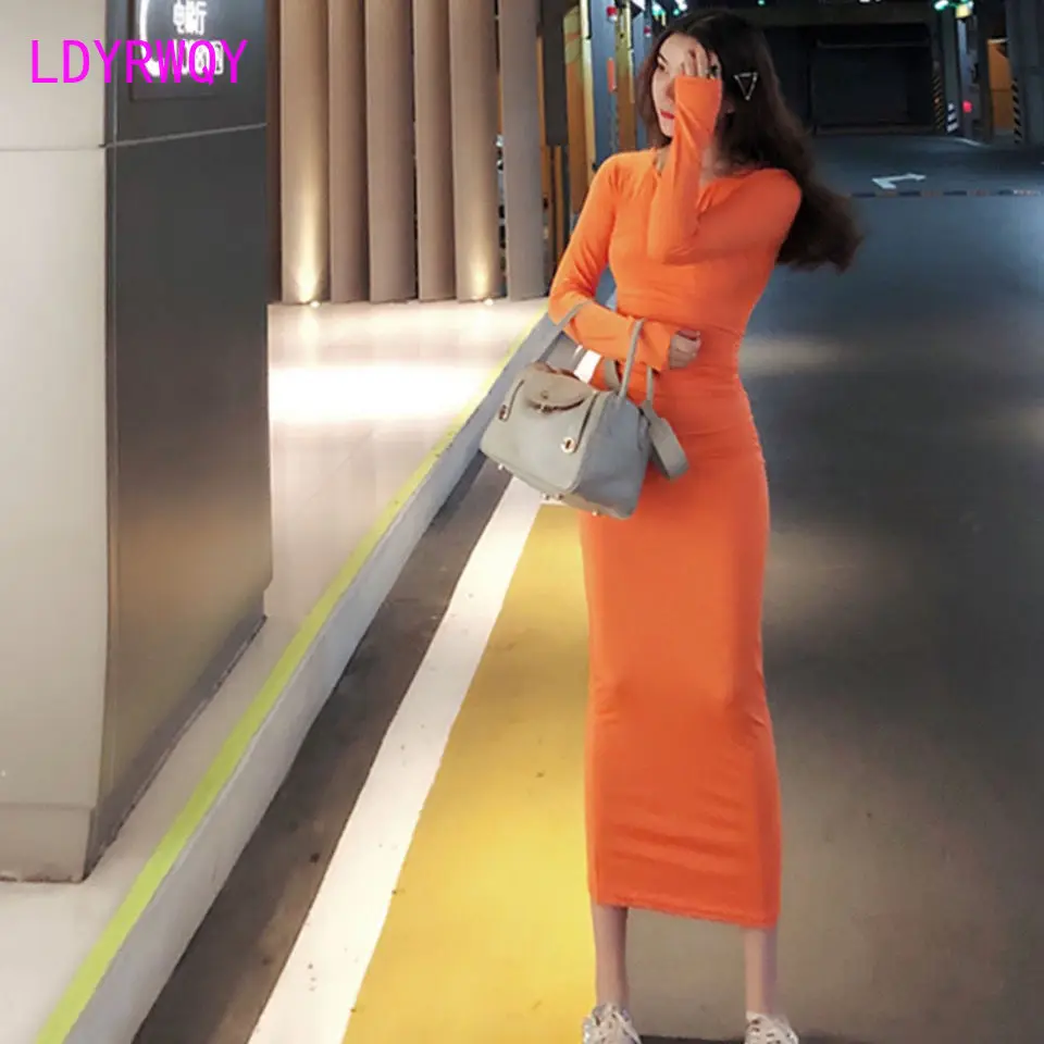 

French retro woman showing figure stretch dress round neck waist long sleeves showing thin hips