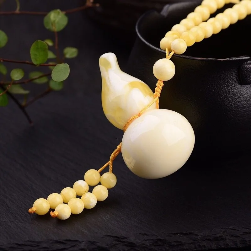 

Amber Wax White Nectar Gourd Pendant Fu Lushou Men and Women Joker Sweater Chain Pendant.