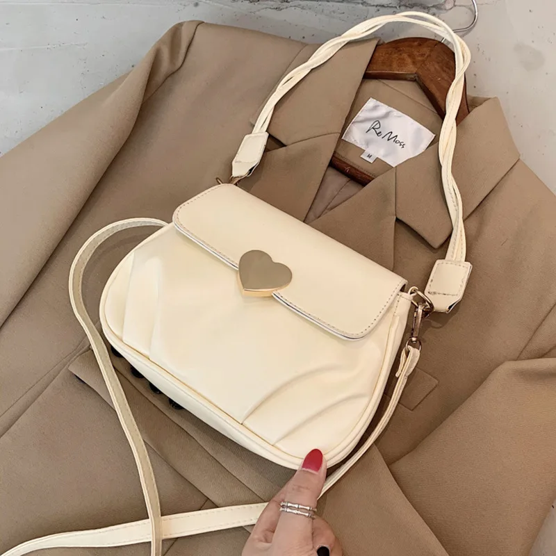 

Women Buckle Shoulder Messenger Bag Fashion New Design Pleated Peach Heart Armpit Small Round Bag Soft Leather Saddle Phone Bag
