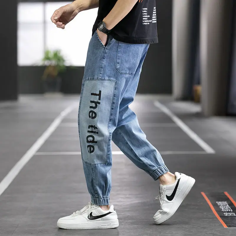 Autumn Men's Denim Harem Pants Letter Print Ankle Banded Elastic Waist Blue Baggy Jeans Stitching Cropped Pants Hip Hop Jeans