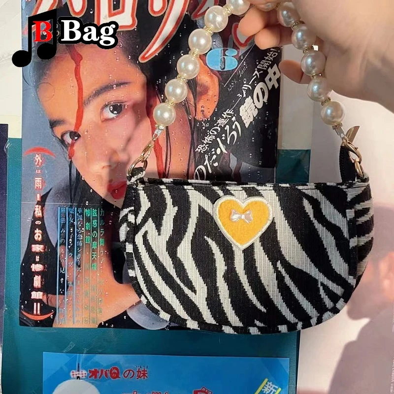 Женская мини-сумка через плечо с принтом зебры и бантом жемчужной цепочкой |