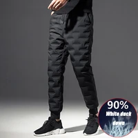 high quality down pants men more comfortable stylish outdoor winter white duck down warm overalls white mountaineering trousers