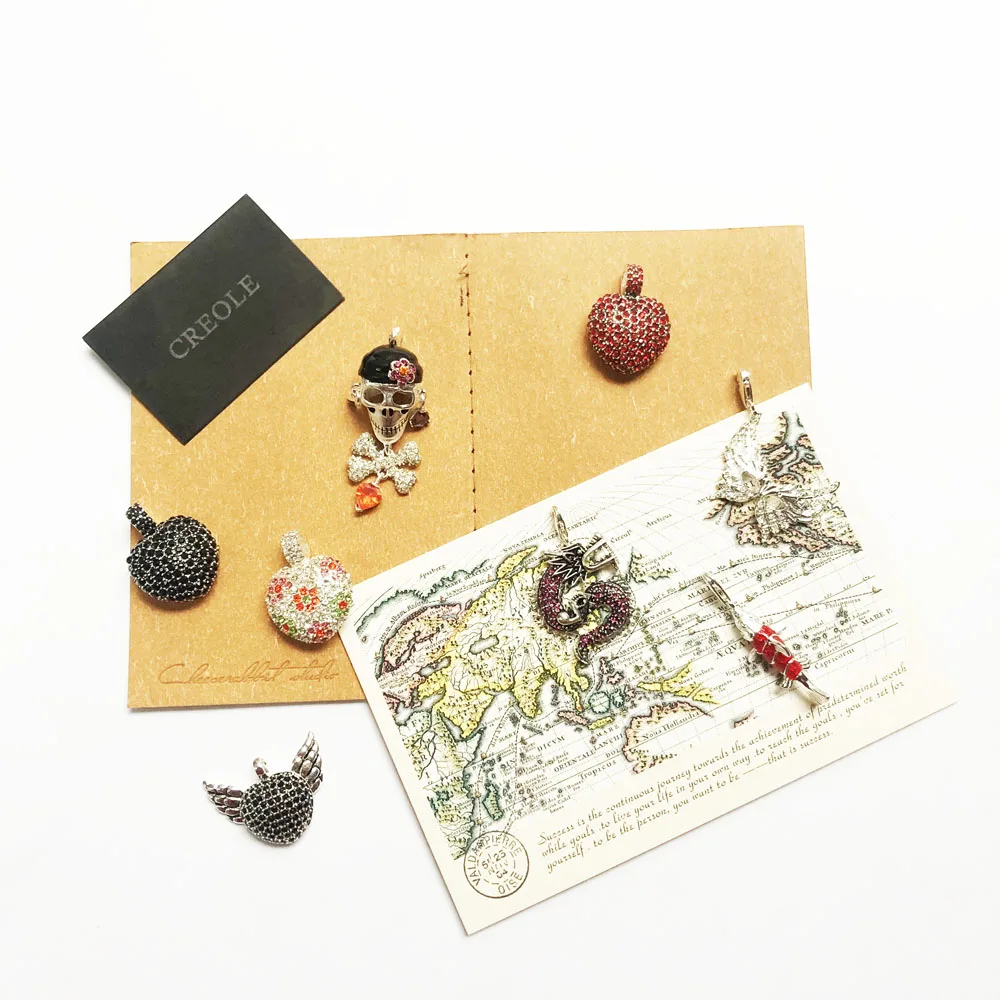 Подвеска с крылатым сердцем маской дракона пиратским черепом красной рыбой