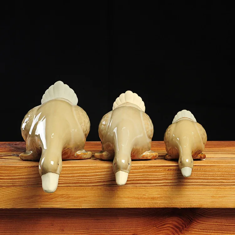 

Creative new ceramic drinking duck new Chinese decoration three-piece crafts duck home decoration absorbent duck