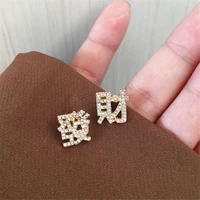 xialuoke fashion metal alloy chinese characters crystal get rich stud earrings for women asymmetric jewelry accessories new year