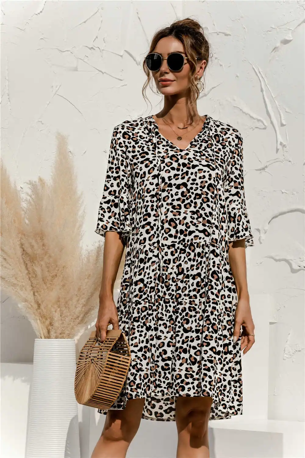 

2021 spring and summer new V-neck trumpet sleeve splicing dress