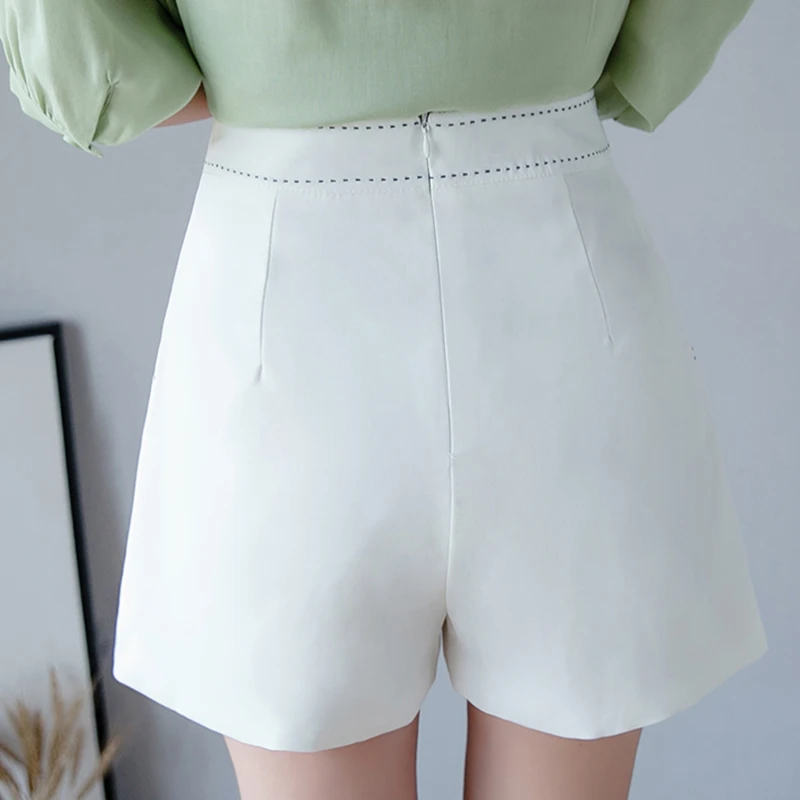 Mode Style D'été Femmes Blanc Shorts Jupes Décontracté Femmes Taille Haute Irrégulière Short Streetwear Simple Boutonnage Mini Jupes