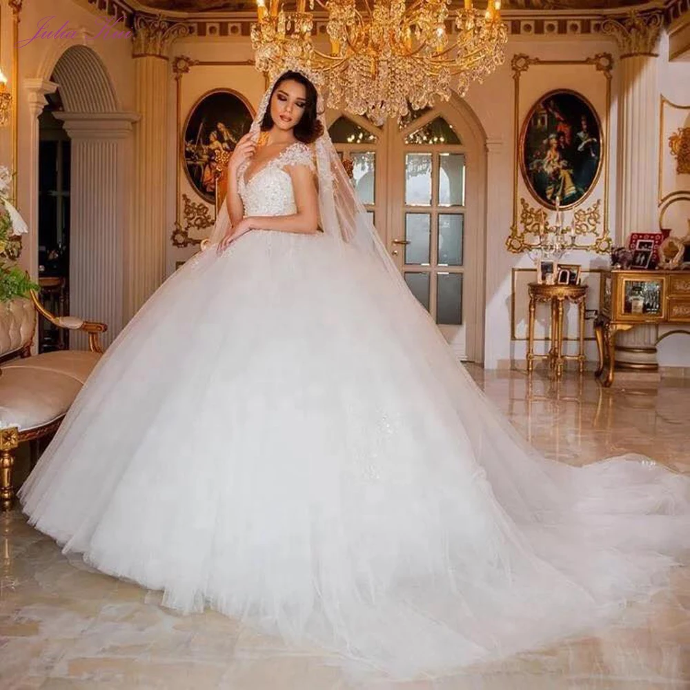 

Julia Kui Gorgeous Full Top Beading Pearls Ball Gown Wedding Dress Deep V Neckline With Puffy Bridal Skirt