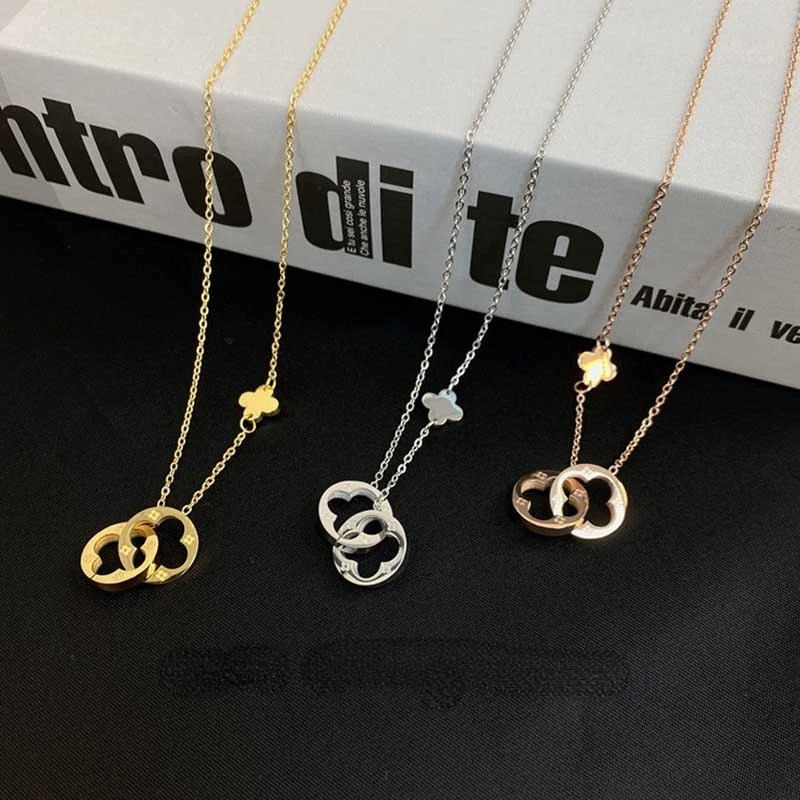 

Korean version of the new four-leaf clover hollow double-ring titanium steel necklace feminine exquisite clover clavicle chain