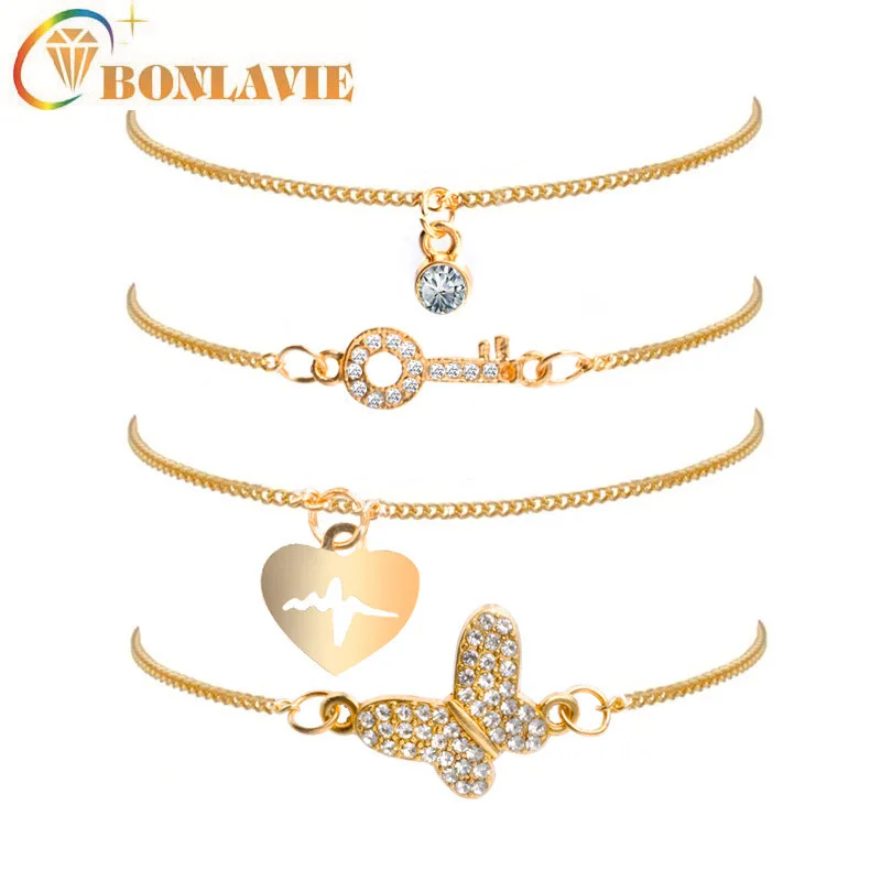 Женский браслет с кристаллами в виде бабочки и сердца 4 штуки золотого цвета