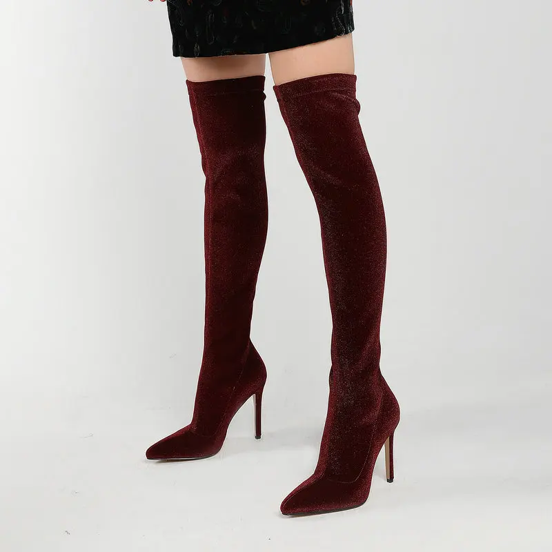 

Женские сапоги выше колена на тонком высоком каблуке, с острым носком