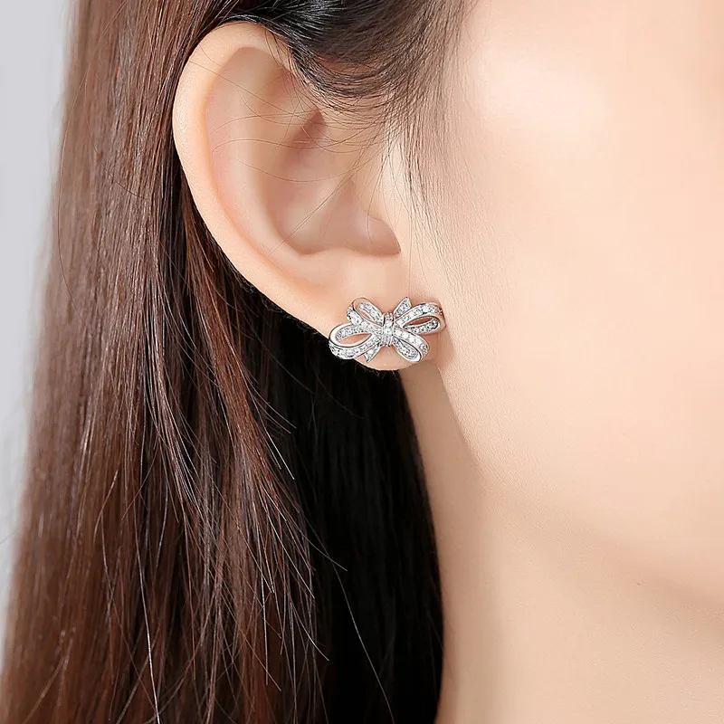 

FXLRY new elegant creative bow Sweet ladies White color inlaid zircon stud for women earrings Jewelry gift