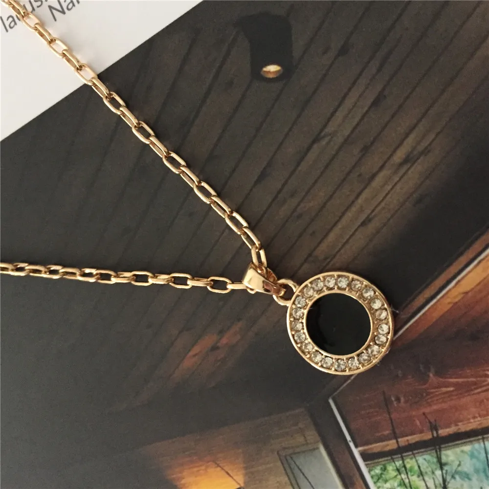 Изящный прозрачный камень вокруг черной эмали круглый диск кулон длинное
