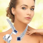 Серьги-гвоздики Huitan женские с голубымбелым фианитом