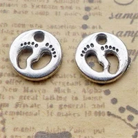 200pcslot cute hollow footprint charms 1111mm metal footmark round charms for handmade jewelry