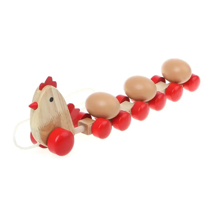 Тянет поезд Деревянный цыпленок тянет вместе с 3 яйцами тележки ранние