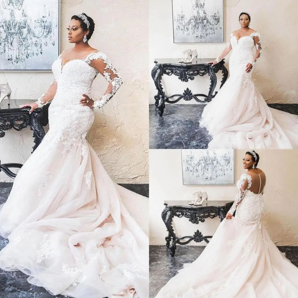 

Свадебное платье с длинными рукавами и кружевной аппликацией