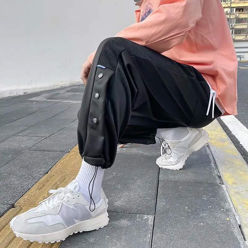 

Breasted trousers men's spring and autumn models ins new trend loose casual trousers Korean drawstring trousers sports pants