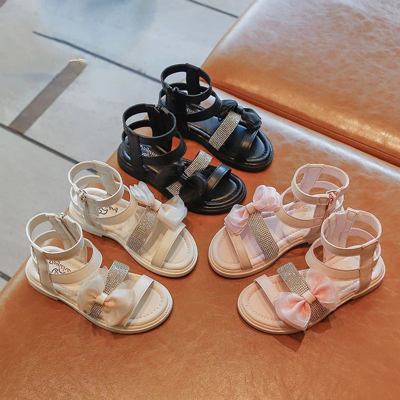 

Сандалии для девочек, Новинка лета 2021, детская модная обувь принцессы с мягкой подошвой и бантом, пляжные римские сандалии на плоской подошв...