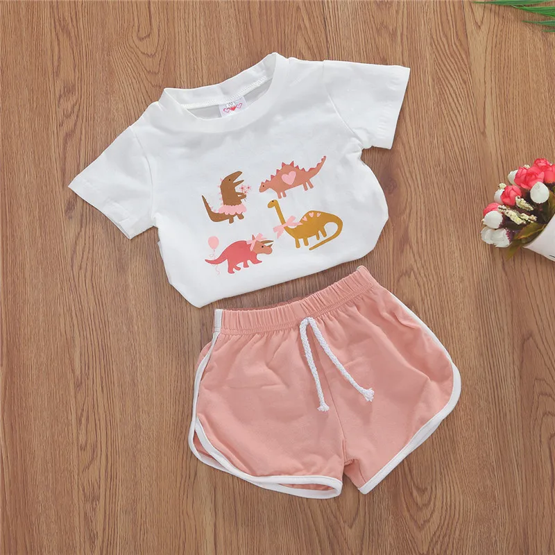 

Kids Girls Summer Clothes Set Casual Pullover Cartoon Dinosaur Printed O-Neck Short Sleeve Blouse Sports Shorts 2Pcs Cotton Suit