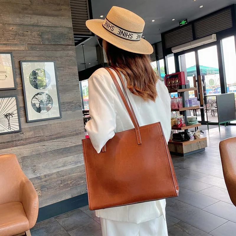 Женская сумка из натуральной кожи черная коричневая вместительная тоут через