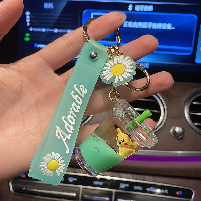 

Hot Fashion Cartoon Pikachu Doll Milk Teacup Liquid Floating Key Foil Pendant for Friend Wholesale