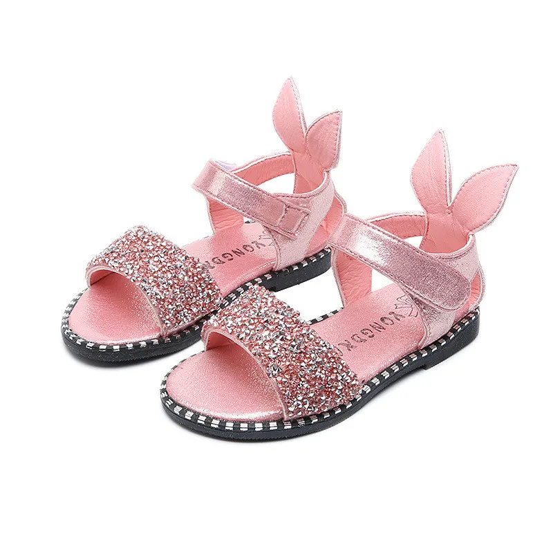 Sandalias infantiles para niñas pequeñas, zapatos infantiles de playa con suela plana y diseño de orejas de conejo con decorado de diamantes de imitación, talla europea